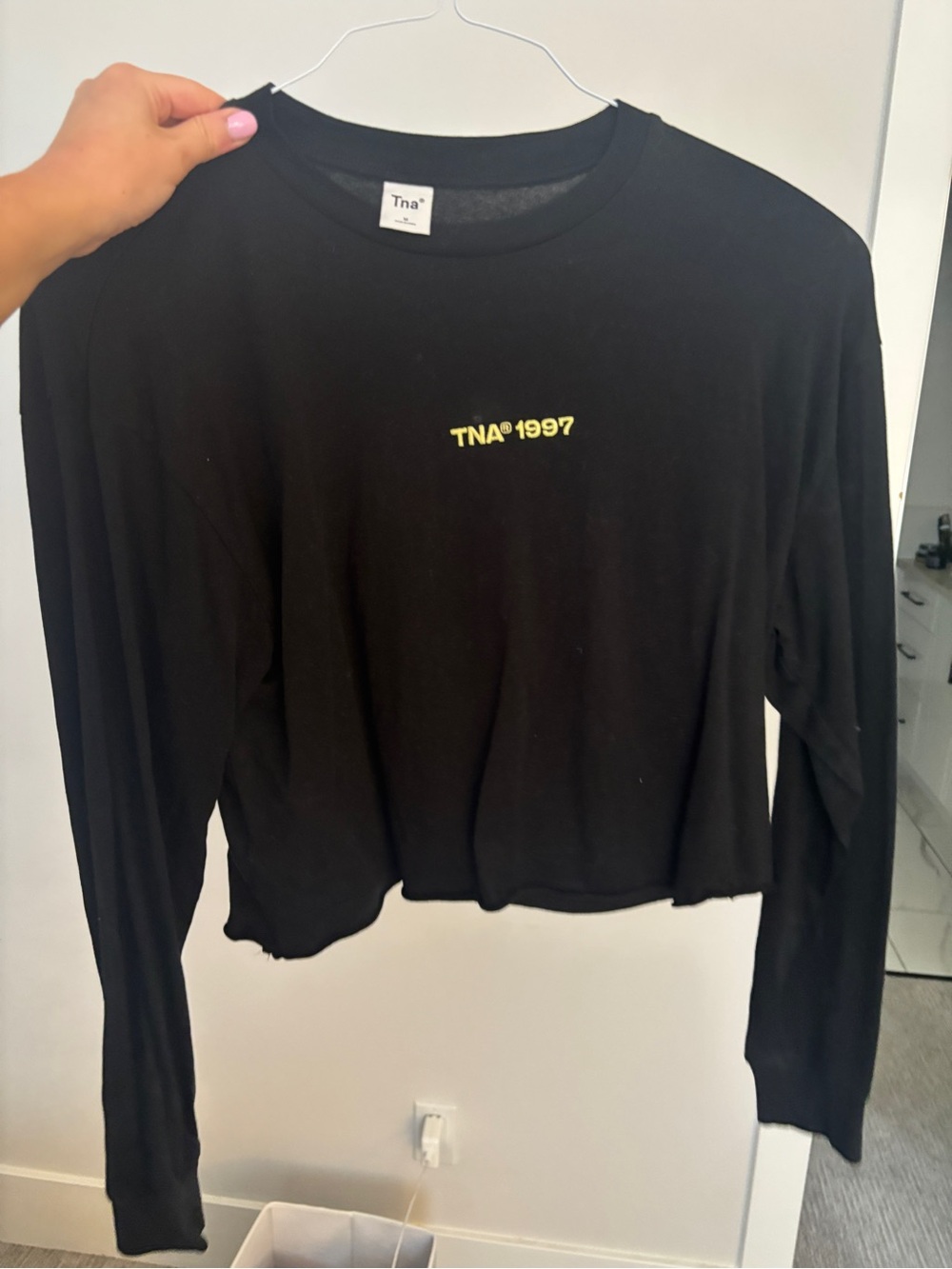 TNA Black Long Sleeve Cropped Tee with Yellow 'TNA 1997' Logo